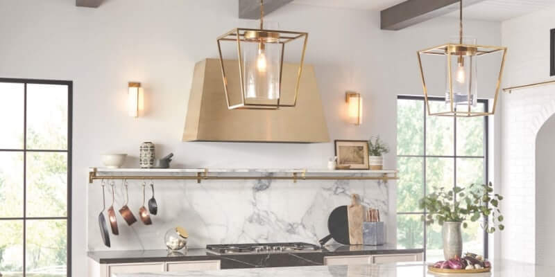 monogram gold hood and marble backsplash